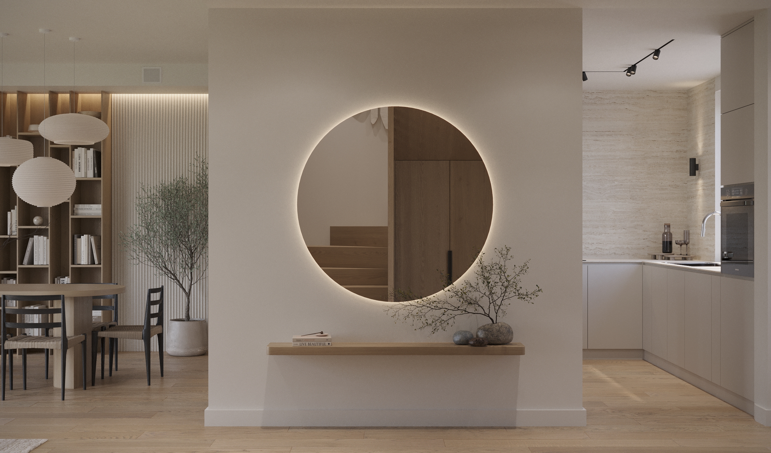 Wnętrze z okrągłym lustrem z podświetleniem, półką i widokiem na kuchnię oraz jadalnię.